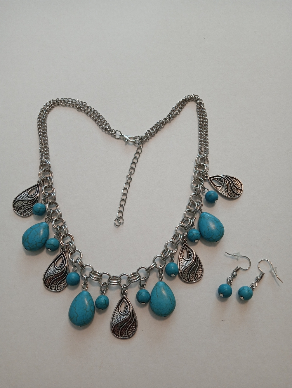 #1196.  Faux Turquoise & Silver Toned Charm Necklace & Earring Set.